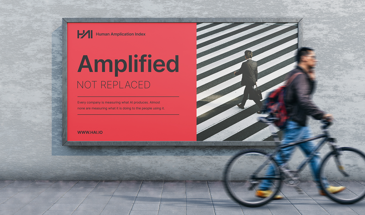 Human Amplification Index billboard reading Amplified not replaced with a cyclist