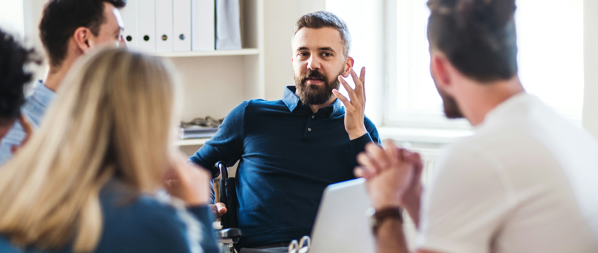 Team discussing ideas around a table in an office